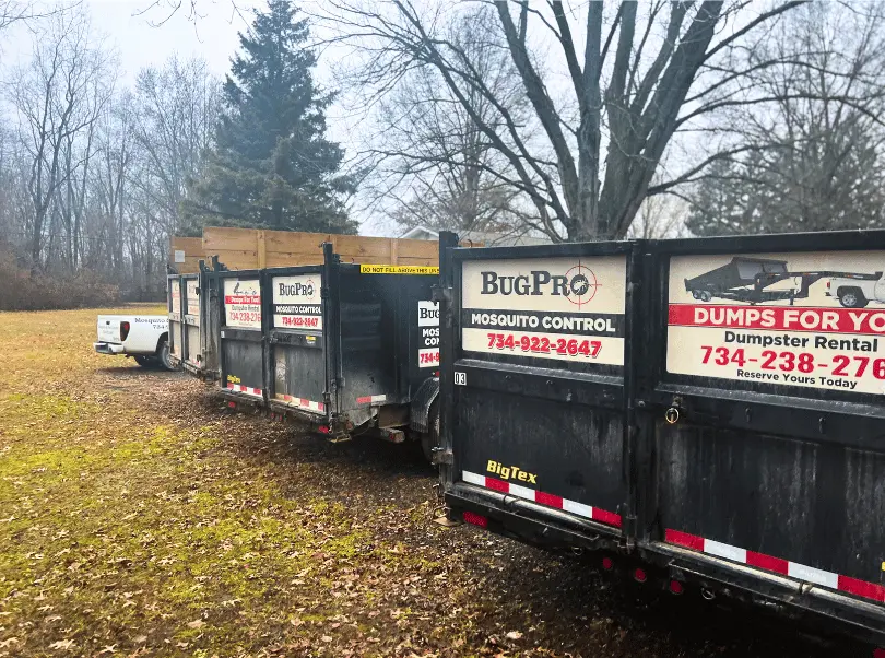 Dumpster rental service in Milan, Michigan: A roll-off dumpster placed in a residential driveway, ready for waste disposal during a home renovation project.